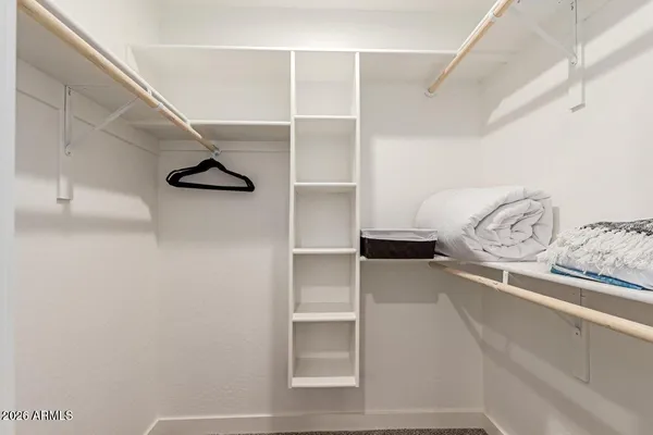 a view of a hallway with closet