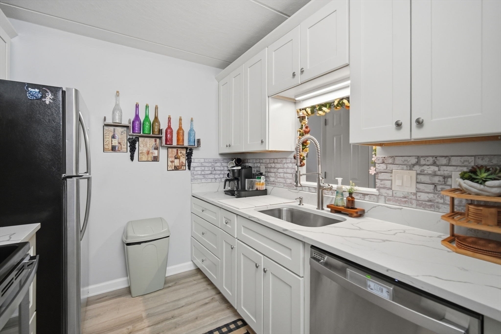 32 Maple Crest Circle, Unit G Holyoke, MA 01040 - Photo 15 of 34 a kitchen with a sink appliances and cabinets