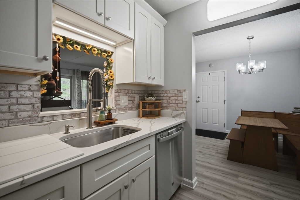 32 Maple Crest Circle, Unit G Holyoke, MA 01040 - Photo 16 of 34 a kitchen with a sink and a refrigerator