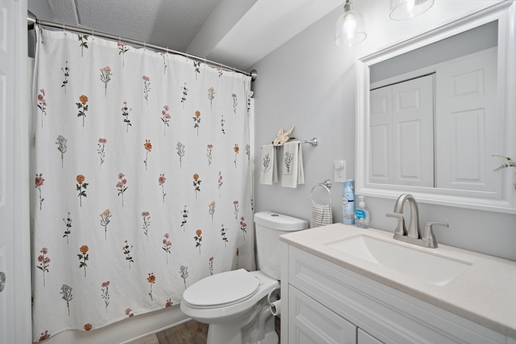 32 Maple Crest Circle, Unit G Holyoke, MA 01040 - Photo 18 of 34 a bathroom with a granite countertop sink toilet and shower