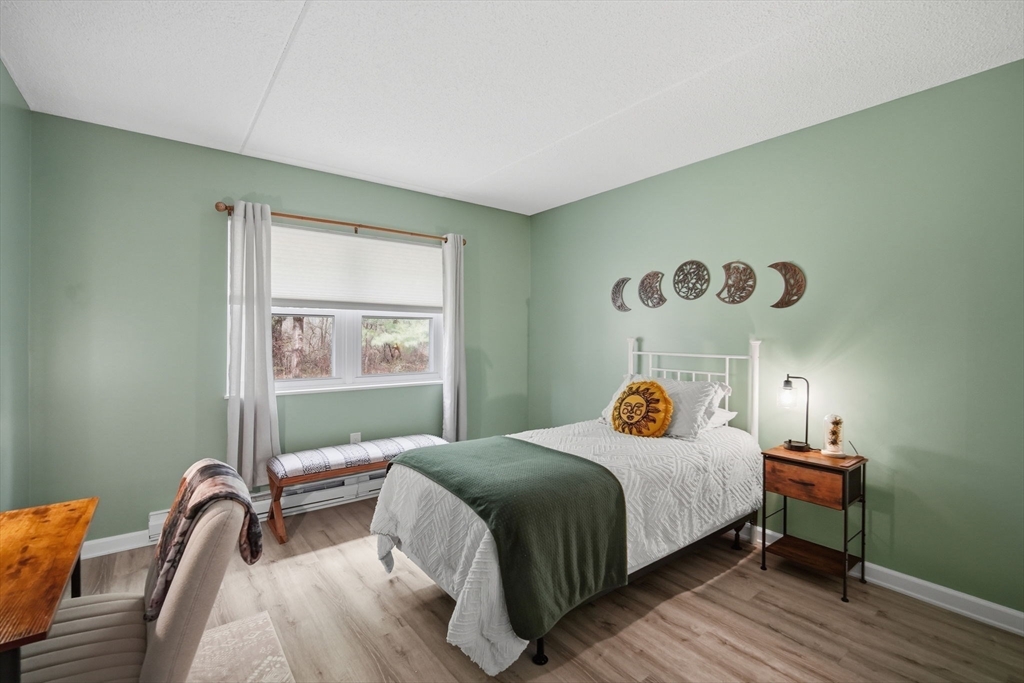 32 Maple Crest Circle, Unit G Holyoke, MA 01040 - Photo 20 of 34 a bedroom with a bed and a window