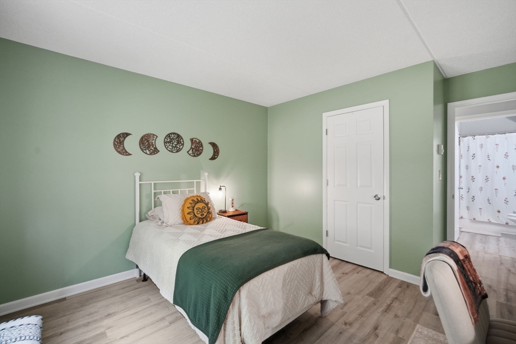 32 Maple Crest Circle, Unit G Holyoke, MA 01040 - Photo 21 of 34 a bedroom with a bed and dresser