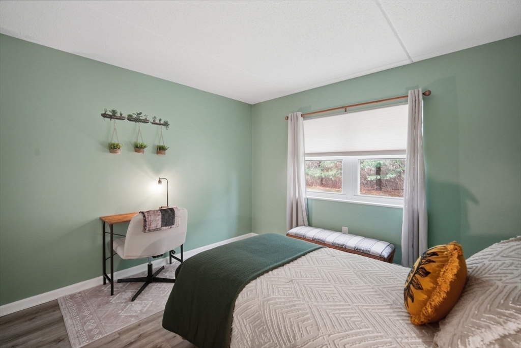 32 Maple Crest Circle, Unit G Holyoke, MA 01040 - Photo 23 of 34 a bedroom with a bed and a window