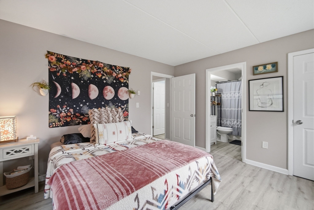 32 Maple Crest Circle, Unit G Holyoke, MA 01040 - Photo 24 of 34 a bedroom with a bed and a window