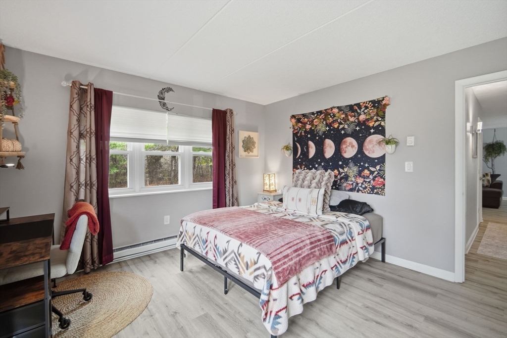 32 Maple Crest Circle, Unit G Holyoke, MA 01040 - Photo 25 of 34 a bedroom with a bed and a window