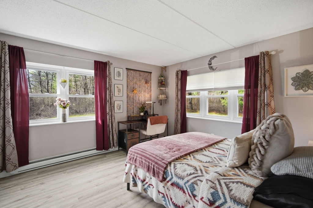 32 Maple Crest Circle, Unit G Holyoke, MA 01040 - Photo 27 of 34 a bedroom with a bed and a window
