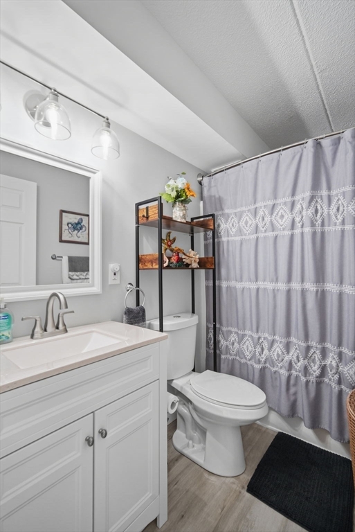32 Maple Crest Circle, Unit G Holyoke, MA 01040 - Photo 28 of 34 a bathroom with a sink a toilet and shower
