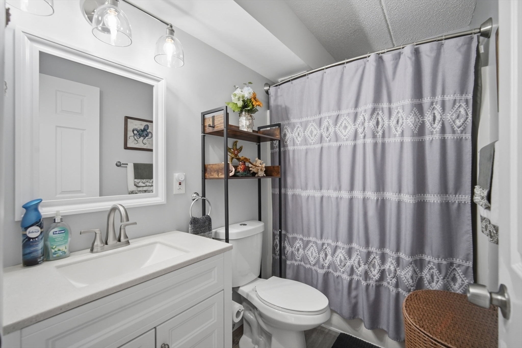 32 Maple Crest Circle, Unit G Holyoke, MA 01040 - Photo 29 of 34 a bathroom with a sink a toilet and shower