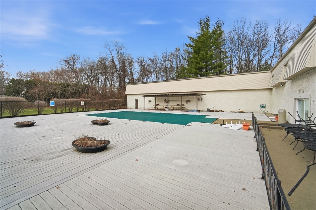 32 Maple Crest Circle, Unit G Holyoke, MA 01040 - Photo 31 of 34 a view of a swimming pool with a patio and a yard