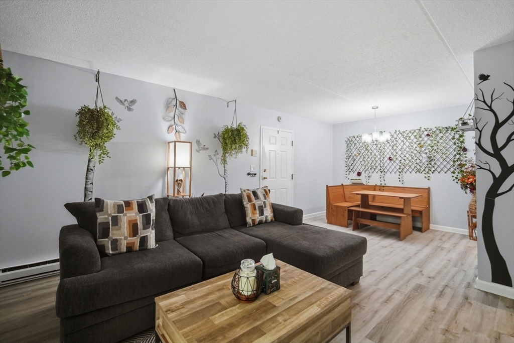 32 Maple Crest Circle, Unit G Holyoke, MA 01040 - Photo 6 of 34 a living room with furniture and a flat screen tv