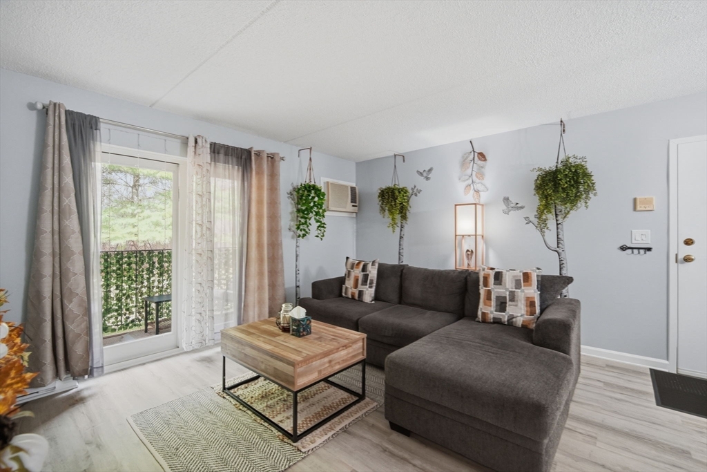 32 Maple Crest Circle, Unit G Holyoke, MA 01040 - Photo 7 of 34 a living room with furniture and a window