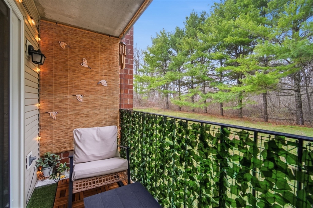 32 Maple Crest Circle, Unit G Holyoke, MA 01040 - Photo 10 of 34 a balcony with table and chairs