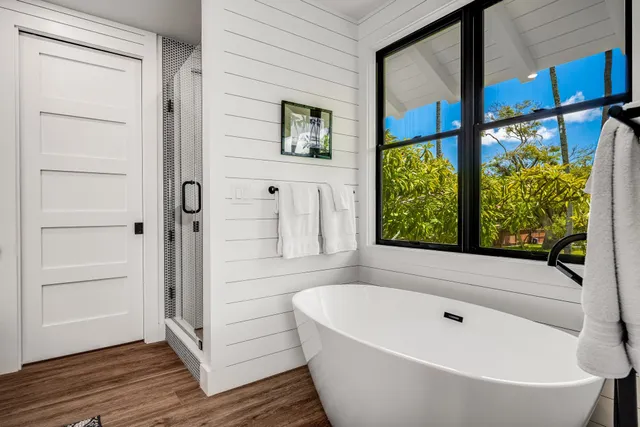 a bathroom with a bathtub and shower