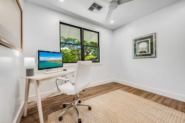 a workspace with furniture window and outside view