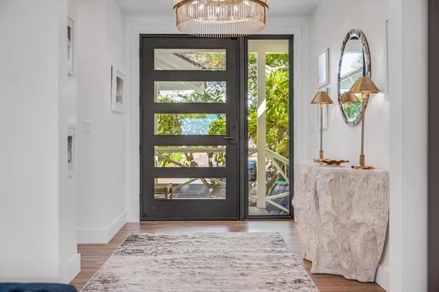 a view of an entryway with wooden floor