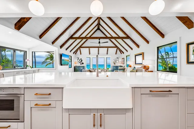 a living room with a sink and chandelier