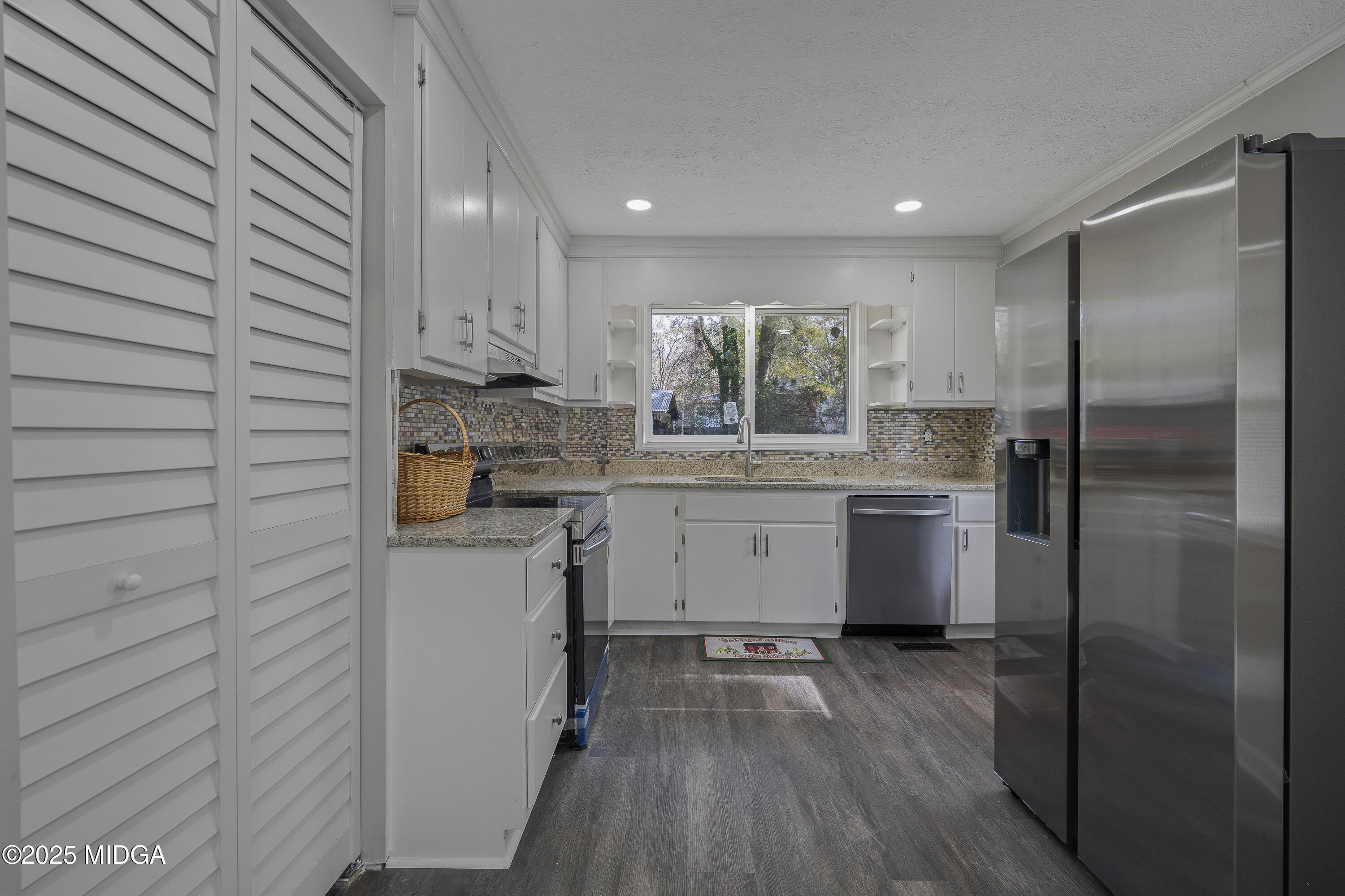 4622 Wilson Road Macon, GA 31206 - Photo 9 of 24 a kitchen with a sink stainless steel appliances and cabinets
