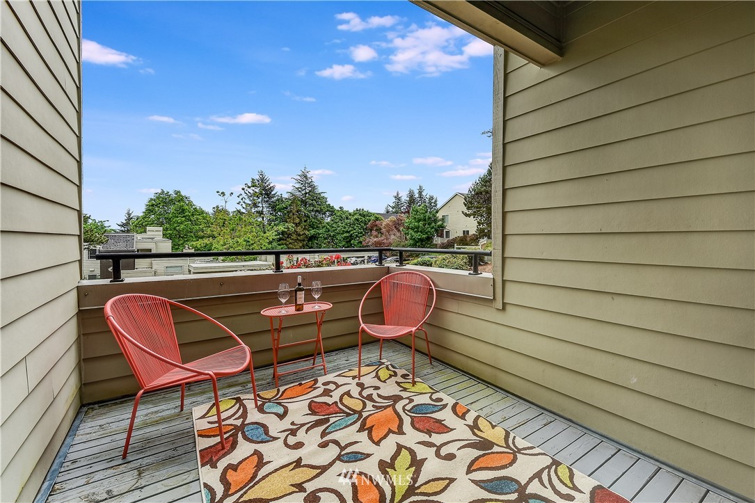 7427 Old Redmond Road, Unit 322 Redmond, WA 98052 - Photo 1 of 1 a backyard of a house with wooden floor and outdoor seating