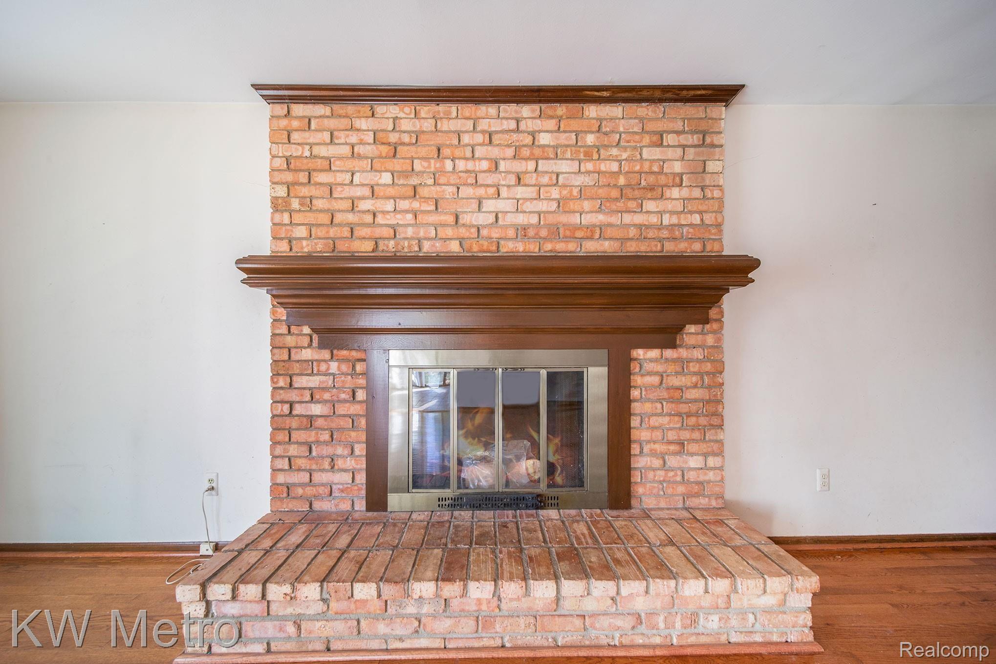 1206 Hathaway Rising Rochester, MI 48306 - Photo 4 of 25 Natural wood burning fireplace