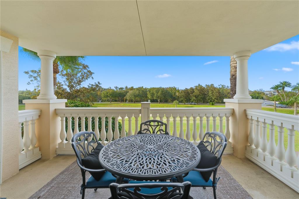 1354 Centre Ct Ridge Drive, Unit 204 Reunion, FL 34747 - Photo 19 of 46 a view of a chair and table in the balcony