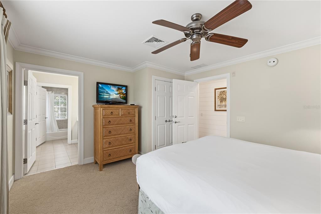 1354 Centre Ct Ridge Drive, Unit 204 Reunion, FL 34747 - Photo 26 of 46 a bedroom with a bed and a ceiling fan