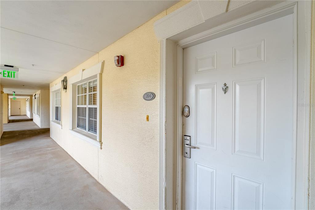 1354 Centre Ct Ridge Drive, Unit 204 Reunion, FL 34747 - Photo 33 of 46 a view of a hallway with windows