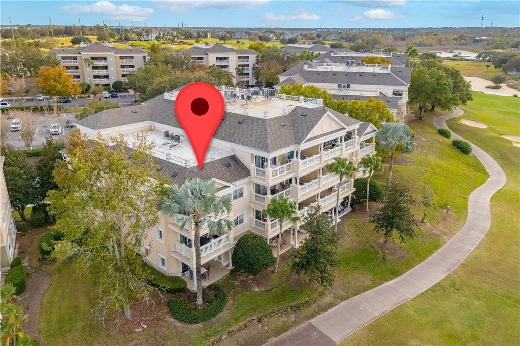 1354 Centre Ct Ridge Drive, Unit 204 Reunion, FL 34747 - Photo 36 of 46 an aerial view of a house with outdoor space and a lake view