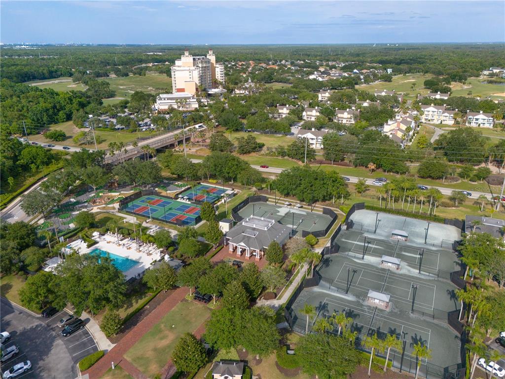 1354 Centre Ct Ridge Drive, Unit 204 Reunion, FL 34747 - Photo 41 of 46 an aerial view of residential building with outdoor space and trees