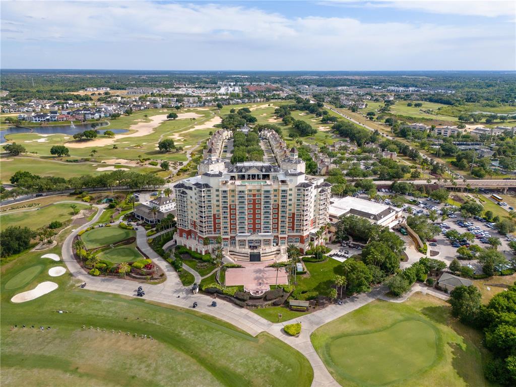 1354 Centre Ct Ridge Drive, Unit 204 Reunion, FL 34747 - Photo 45 of 46 an aerial view of residential building and lake view