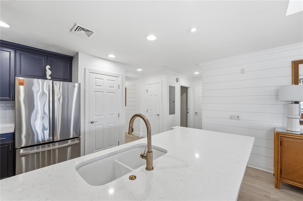 1354 Centre Ct Ridge Drive, Unit 204 Reunion, FL 34747 - Photo 8 of 46 a kitchen with stainless steel appliances a refrigerator and a sink
