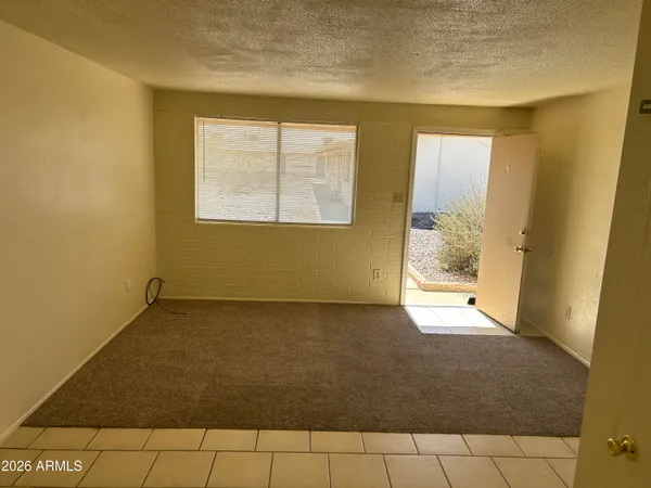 a view of an empty room and window