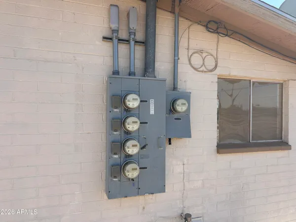 a bathroom with shower and mirror