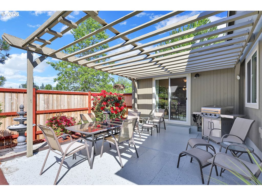 87836 8th Street Veneta, OR 97487 - Photo 25 of 25 a view of a patio with table and chairs and potted plants