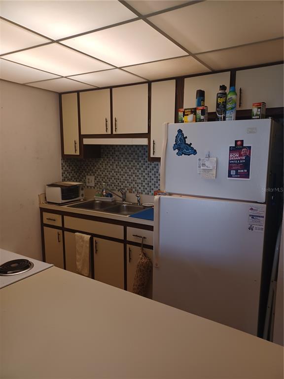 215 South McMullen Booth Road, Unit 183 Clearwater, FL 33759 - Photo 10 of 12 a kitchen with stainless steel appliances a refrigerator and a stove