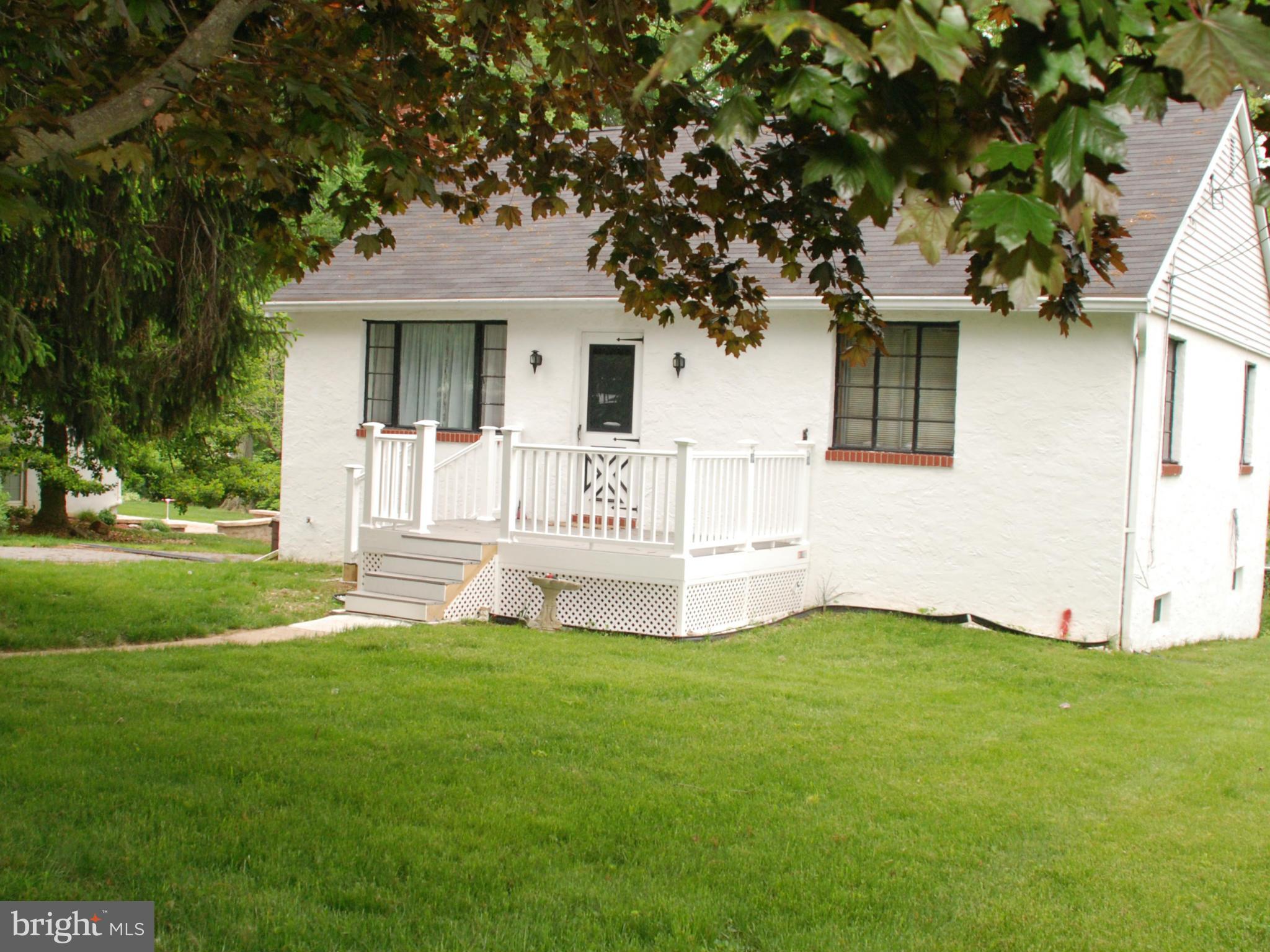 239 Gralan Road Baltimore, MD 21228 - Photo 1 of 21 a front view of a house with a yard and porch