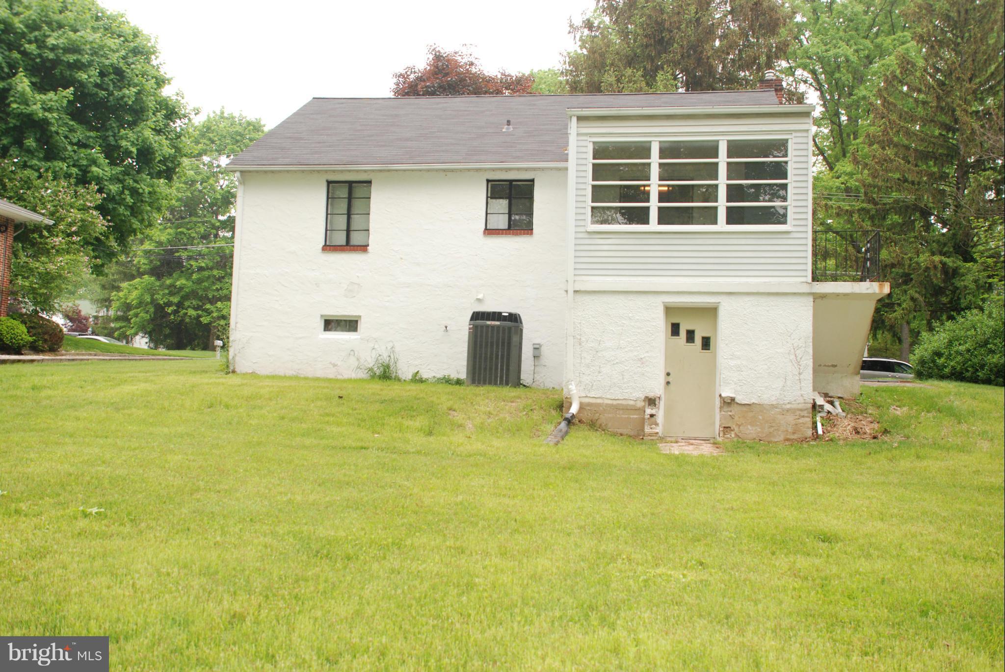 239 Gralan Road Baltimore, MD 21228 - Photo 18 of 21 a front view of a house with a yard