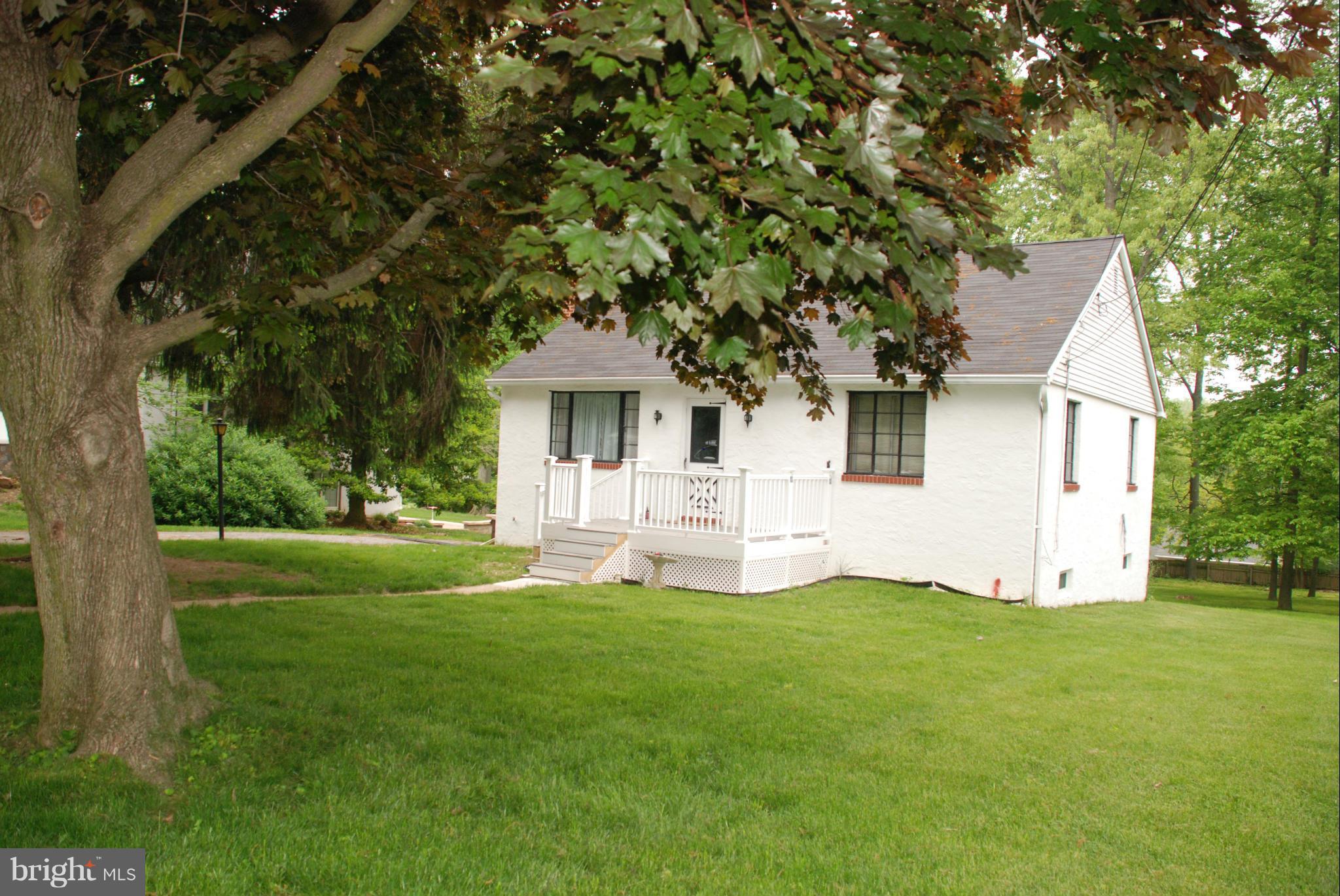 239 Gralan Road Baltimore, MD 21228 - Photo 20 of 21 a front view of a house with a yard and garage