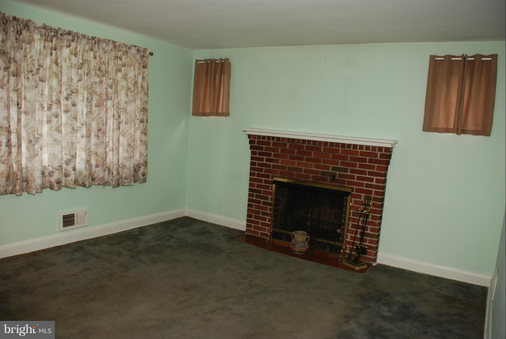 239 Gralan Road Baltimore, MD 21228 - Photo 3 of 21 a living room with a fireplace