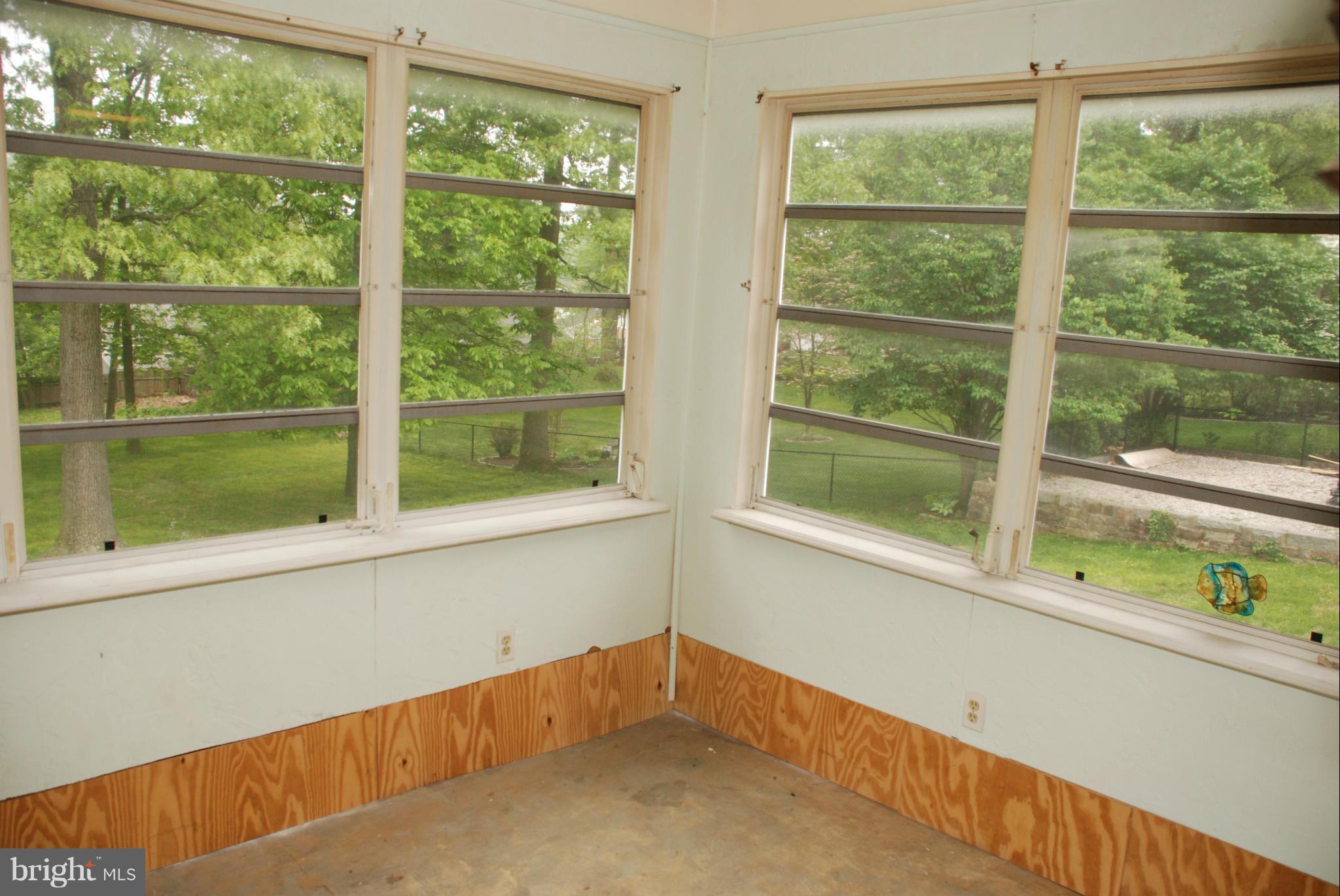 239 Gralan Road Baltimore, MD 21228 - Photo 7 of 21 a view of an empty room with a window