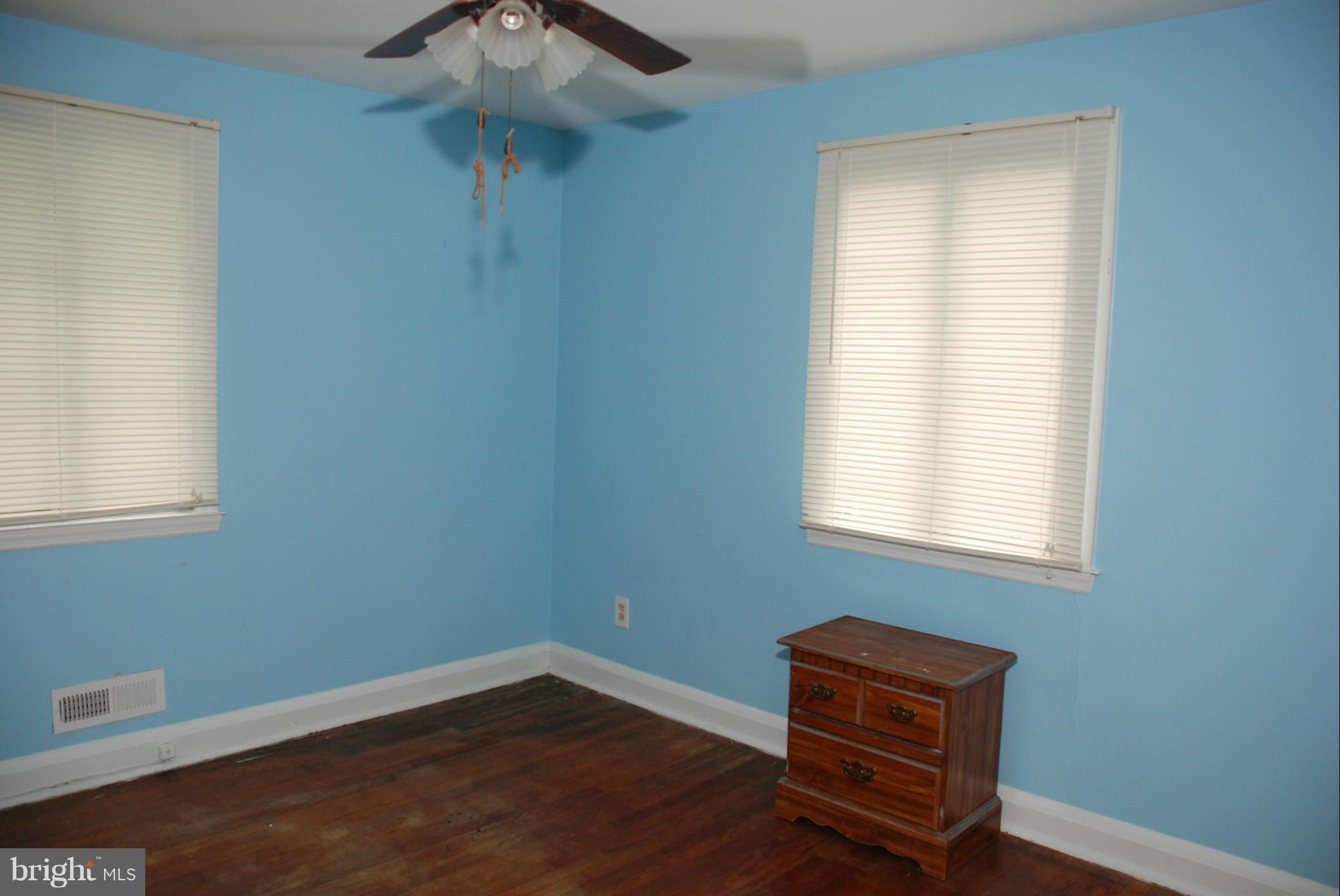 239 Gralan Road Baltimore, MD 21228 - Photo 9 of 21 an empty room with a window