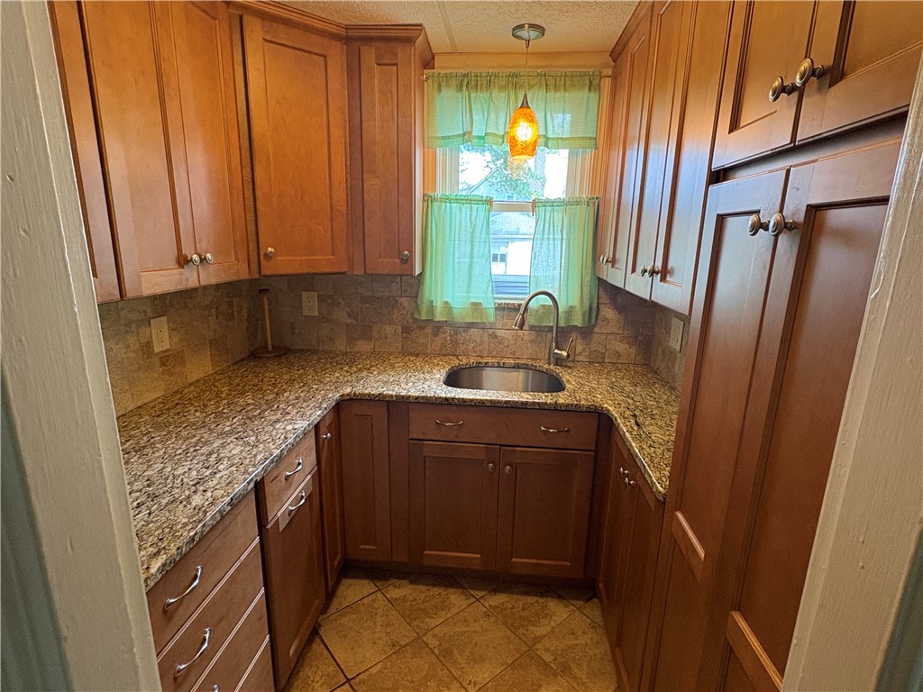 137 Rutherglen Avenue Providence, RI 02907 - Photo 5 of 37 Granite kitchen.