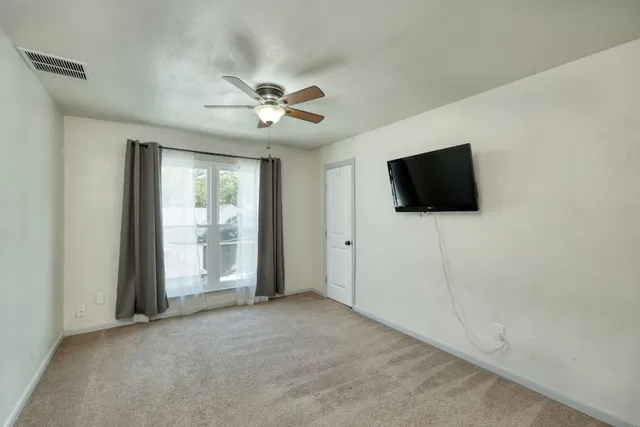 a view of a livingroom with a flat screen tv