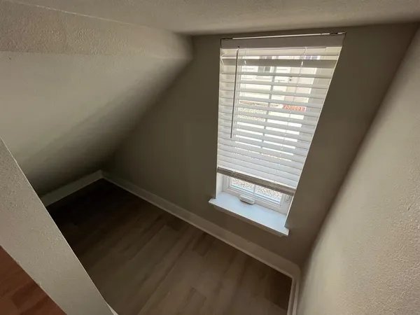 a view of an empty room and window