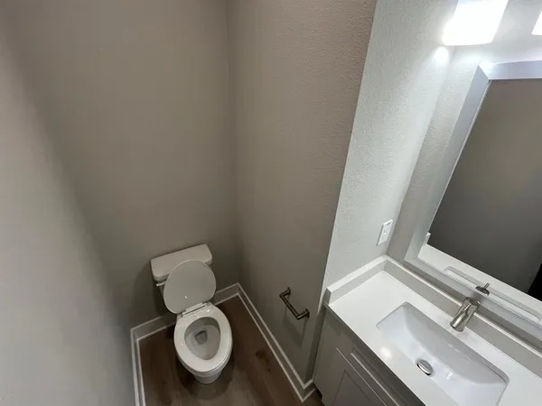a view of hallway with wooden floor