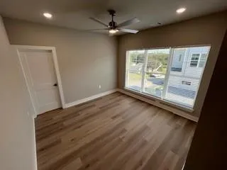 en empty room with wooden floor