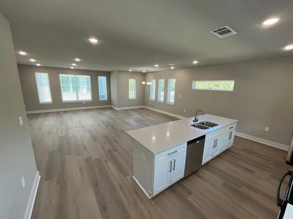 a spacious bathroom with a granite countertop sink