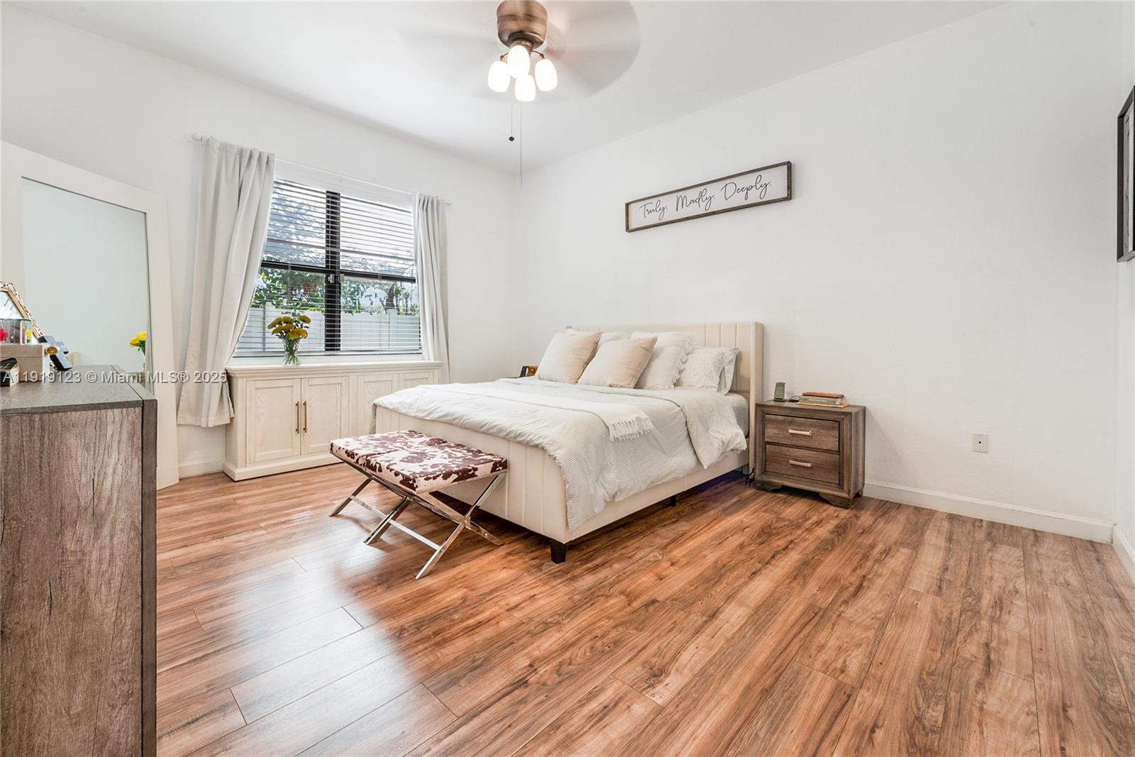 3550 West 86th Terrace, Unit 3550 Hialeah, FL 33018 - Photo 11 of 17 a bedroom with a bed and window