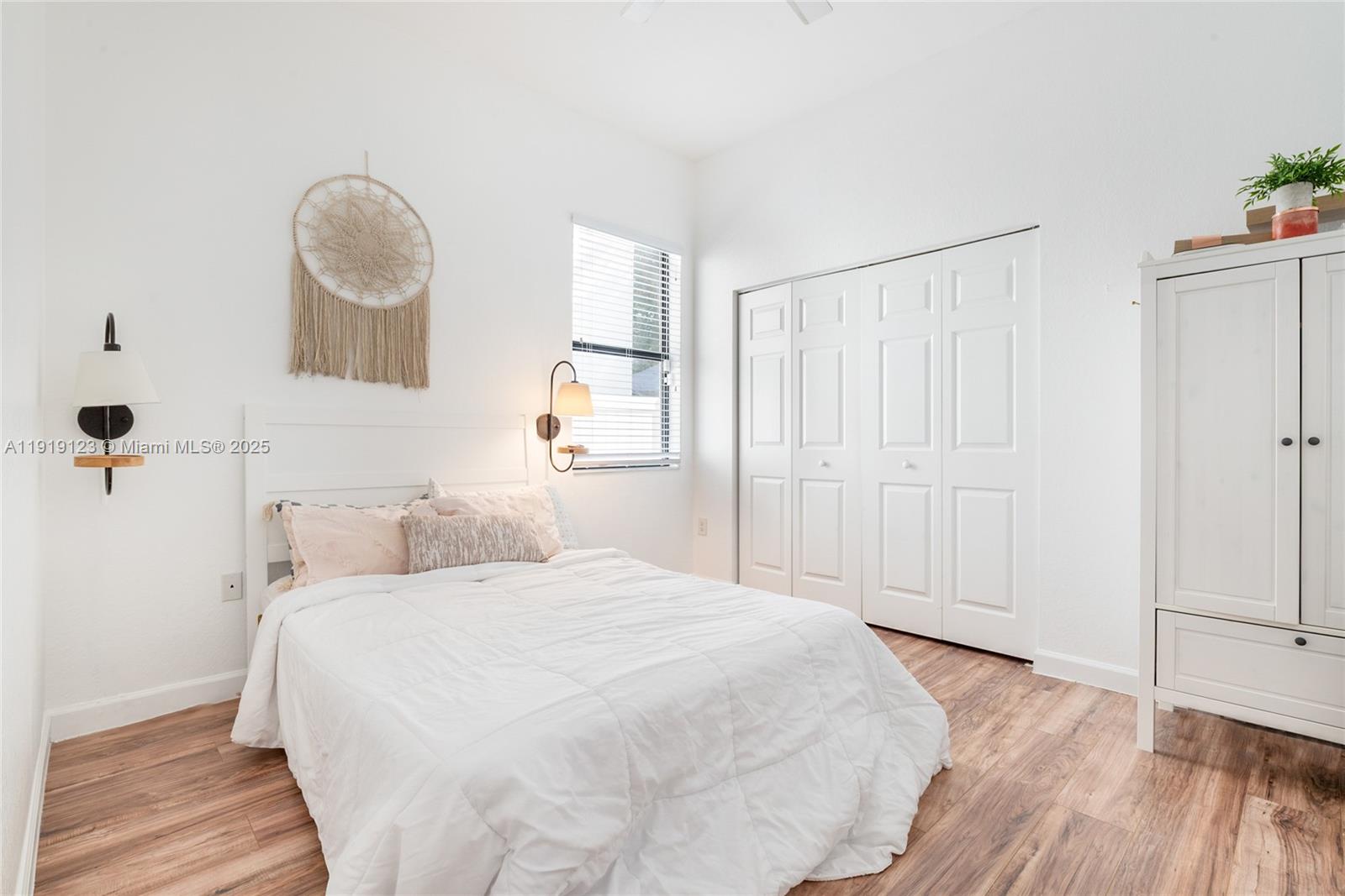 3550 West 86th Terrace, Unit 3550 Hialeah, FL 33018 - Photo 15 of 17 a bedroom with a bed and a window