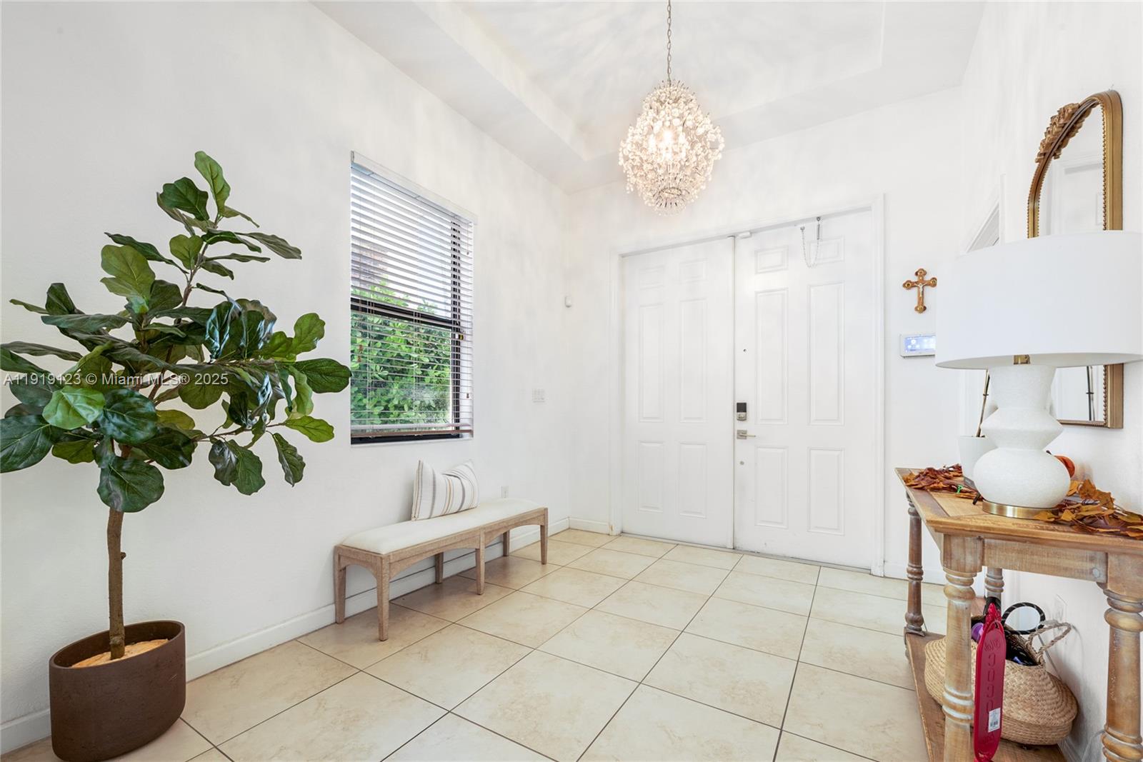 3550 West 86th Terrace, Unit 3550 Hialeah, FL 33018 - Photo 2 of 17 a living room with furniture and a potted plant