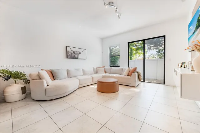a living room with furniture and a couch